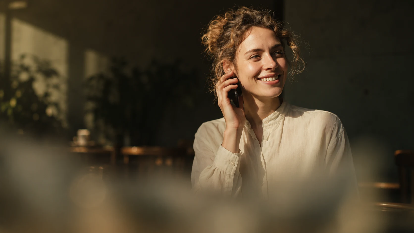 A freelancer smiling on a call with a client